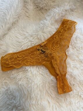 RACHEL Rachel Roy Gold Lace Thong Panty well worn